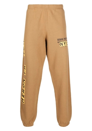 Heron Preston logo-print track pants - Brown