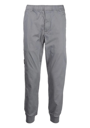 AAPE BY *A BATHING APE® logo-print tapered trousers - Grey