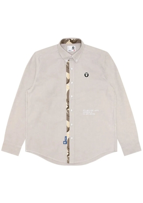 AAPE BY *A BATHING APE® Moonface-embroidered cotton shirt - Neutrals