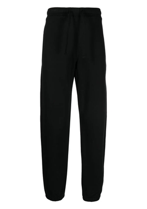 Maharishi logo-embroidered track pants - Black