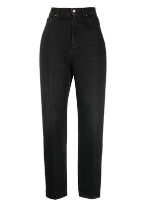 TOTEME faded-effect tapered-leg jeans - Black