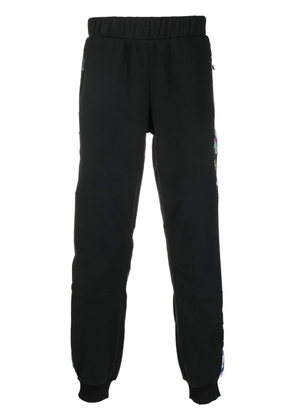 The North Face graphic-print panelled track pants - Black