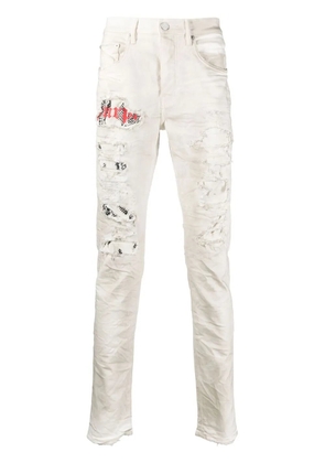 Purple Brand paint-splatter tapered jeans - White