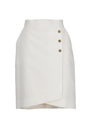 CHANEL Pre-Owned golden-buttons asymmetric-hem midi skirt - White