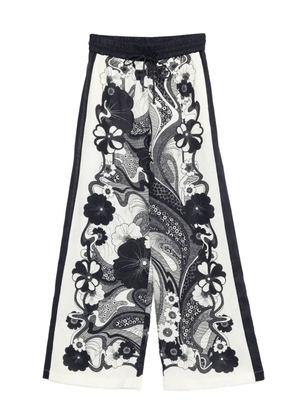 ALEMAIS floral-print linen trousers - Neutrals