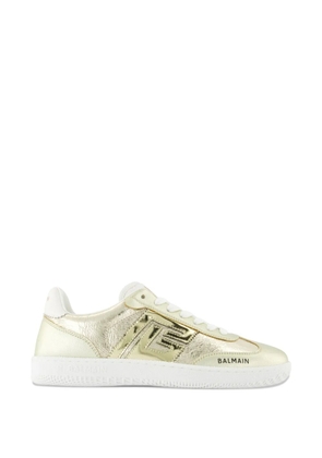 Balmain almond-toe swan sneakers - Gold