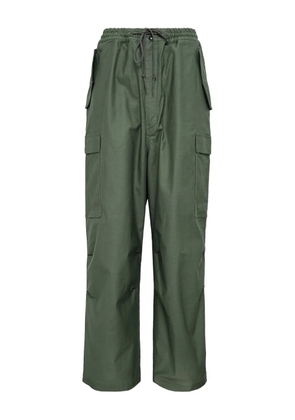 Junya Watanabe MAN cargo-pocket urethane trousers - Green