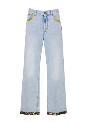 Valentino Garavani floral-hem embroidered jeans - Blue