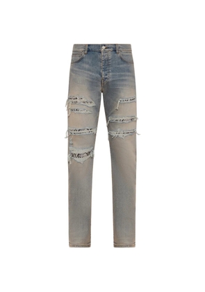 AMIRI distressed snake slim jeans - Blue