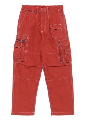 This Is Never That Crazy multi-zip cargo trousers - Red