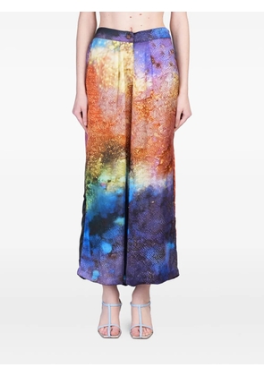 YAVI abstract-print trousers - Blue
