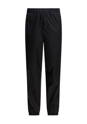 Alexander McQueen skull-jacquard track pants - Black