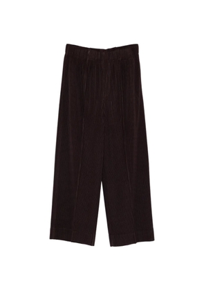 Homme Plissé Issey Miyake pleated-design trousers - Brown