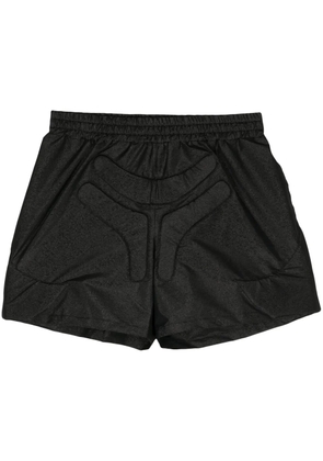 Walter Van Beirendonck Space logo-embossed track shorts - Black