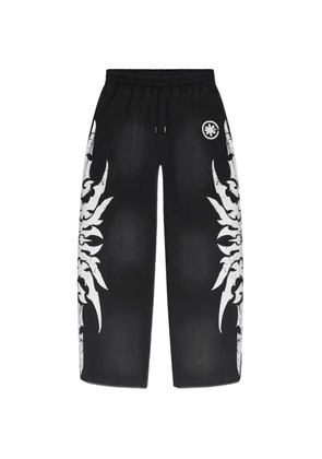LOSTSHDWS graphic-print trousers - Black