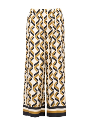 ERES Tube geometric-print wide-leg trousers - White