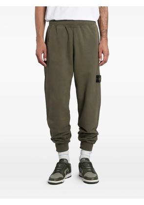 Stone Island logo-patch cuffed track pants - Green