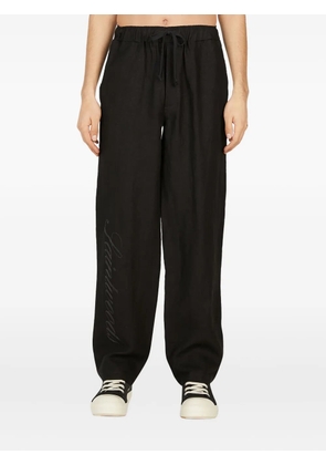 Saintwoods logo-print trousers - Black