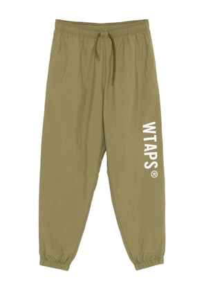 WTAPS logo-print track pants - Green