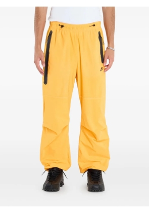 Nike zip-pocket woven trousers - Yellow