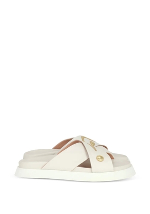 Moschino cross strap logo sandals - Neutrals