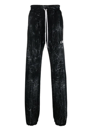 AMIRI cracked-dye logo track pants - Black