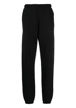 The Attico Penny logo-embossed cotton track pants - Black