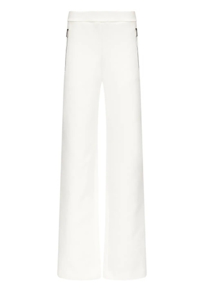 AREA embossed handprint track pants - White