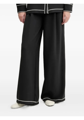 Stine Goya contrast-stitch wide-leg trousers - Black