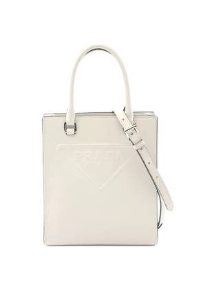 Prada Pre-Owned 2010s embossed logo leather tote bag - Neutrals