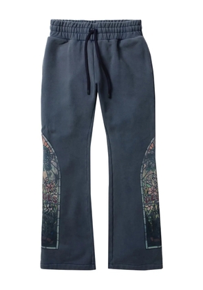 Who Decides War printed track pants - Blue