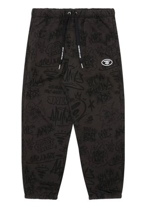 AAPE BY *A BATHING APE® graffiti-print track pants - Brown