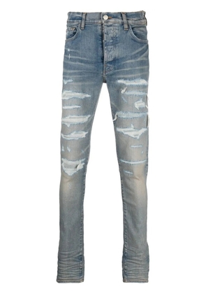 AMIRI distressed-effect skinny jeans - Blue