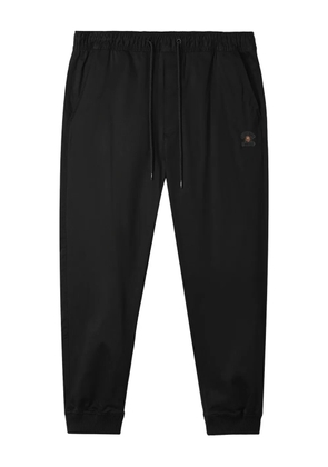 FINGERCROXX logo-patch cuffed trousers - Black