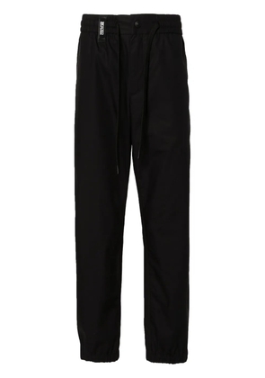 Versace Jeans Couture logo-strap tapered-leg trousers - Black