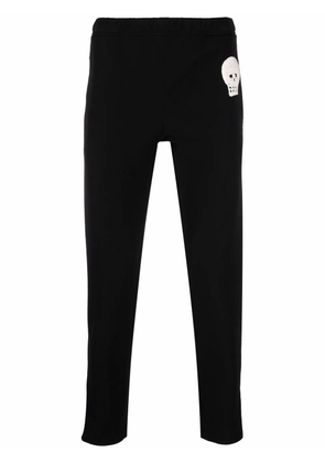 Alexander McQueen skull-patch slim-fit track pants - Black