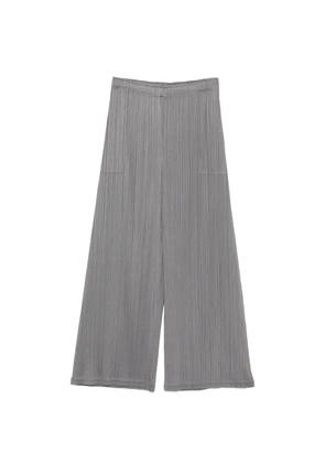 Pleats Please Issey Miyake pleated side-pocket trousers - Grey