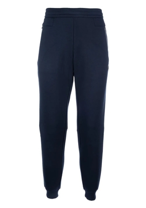 Ea7 Emporio Armani rubberised logo track pants - Blue