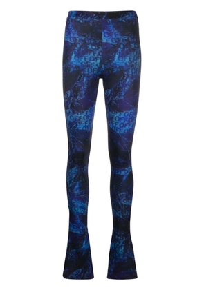 Off-White all-over logo-print flared trousers - Blue