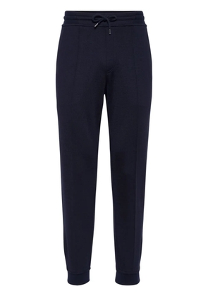 Brunello Cucinelli pressed-crease drawstring trousers - Blue