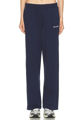 Sporty & Rich Serif Logo Wide Sweatpant in Dark Navy - Navy. Size S (also in M, XL).