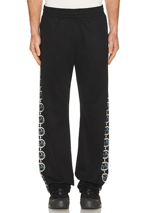 Pleasures Mythic Hope Track Pants in Black - Black. Size M (also in S, L, XL/1X).