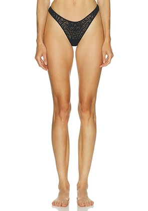 Wolford Animalier Thong in Black - Black. Size M (also in XS, S, L).