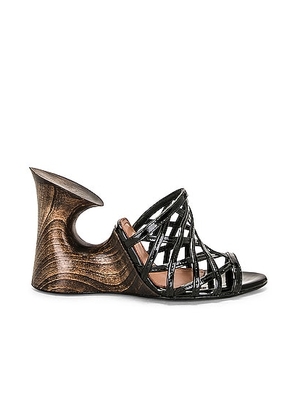ALAÃA Sculpture Mule Sandal in Noir - Black. Size 41 (also in 36, 37).
