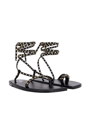 ALAÃA Flat Strappy Sandal in Noir - Black. Size 37 (also in 39, 41, 38, 36, 40).
