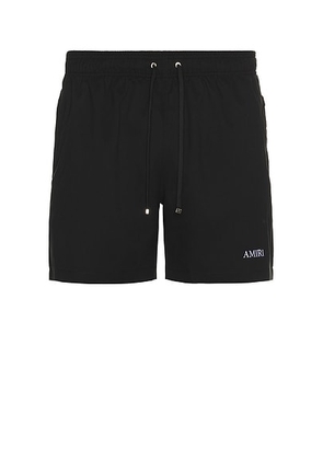 Amiri Swim Trunk in Black - Black. Size M (also in ).