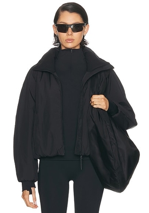 Beyond Yoga Warm Up Puffer Jacket in Black - Black. Size M (also in L, S, XS).