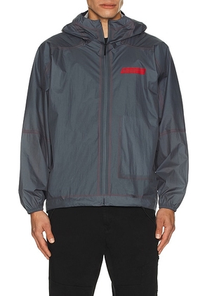 District Vision x Massimo Osti Studio Pertex Shell Hoodie in Navy - Grey. Size M (also in L, S).