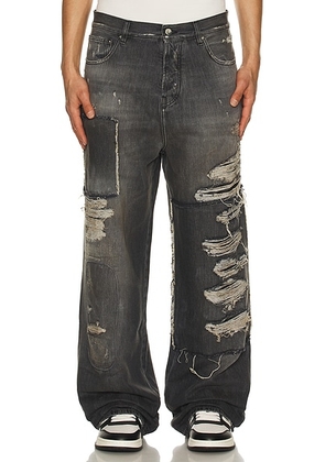 Amiri Carpenter Repaired Baggy Jean in Crafted Black - Black. Size 31 (also in 30, 32, 33, 34, 36).