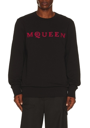 McQueen Embroidered Sweatshirt in Black - Black. Size M (also in L, S, XL/1X, XXL/2X).